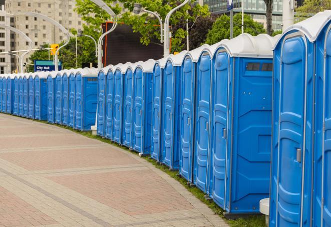 a row of portable restrooms set up for a special event, providing guests with a comfortable and sanitary option in Butner, NC